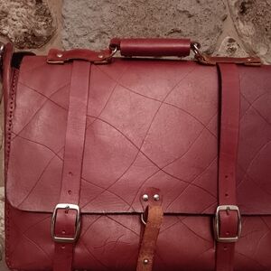 Red Leather Briefcase with Textured Design and Silver Buckles
